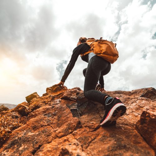 Success,Woman,Hiker,Hiking,On,Sunrise,Mountain,Peak,-,Young